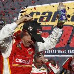 Matt Kenseth celebrates his win in Victory Lane after a NASCAR Cup Series auto race at Phoenix International Raceway Sunday, Nov. 12, 2017, in Avondale, Ariz. (AP Photo/Ross D. Franklin)