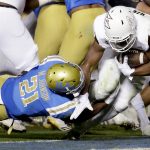 Arizona State running back Demario Richard, right, scores past UCLA's Mossi Johnson during the first half of an NCAA college football game in Pasadena, Saturday, Nov. 11, 2017. (AP Photo/Chris Carlson)