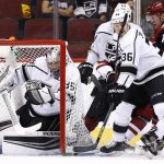 Los Angeles Kings goalie Darcy Kuemper (35) is hit by a dislodged net while Kings' Jussi Jokinen (36) is hit with a stick as Kings' Derek Forbort (24) battles with Coyotes' Christian Dvorak (18) during the first period of an NHL hockey game Friday, Nov. 24, 2017, in Glendale, Ariz. (AP Photo/Ross D. Franklin)