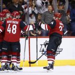 Arizona Coyotes center Zac Rinaldo, right, celebrates his goal against the Winnipeg Jets with Arizona Coyotes defenseman Alex Goligoski, left, left wing Jordan Martinook (48) and other teammates during the first period of an NHL hockey game Saturday, Nov. 11, 2017, in Glendale, Ariz. (AP Photo/Ross D. Franklin)