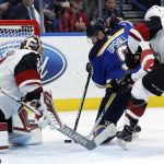 St. Louis Blues' Scottie Upshall, center, is unable to score past Arizona Coyotes goalie Antti Raanta, of Finland, as Coyotes' Christian Fischer, right, defends during the second period of an NHL hockey game Thursday, Nov. 9, 2017, in St. Louis. (AP Photo/Jeff Roberson)