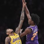 Phoenix Suns forward Josh Jackson, right, shoots as Los Angeles Lakers forward Brandon Ingram defends during the first half of an NBA basketball game, Friday, Nov. 17, 2017, in Los Angeles. (AP Photo/Mark J. Terrill)
