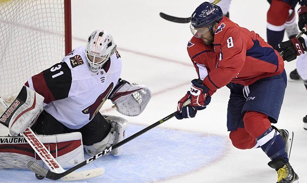 Washington Capitals left wing Alex Ovechkin (8), of Russia, tries to get the puck past Arizona Coyo...