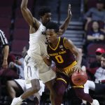 Arizona State's Tra Holder, right, drives into Xavier's Quentin Goodin during the first period of an NCAA college basketball game Friday, Nov. 24, 2017, in Las Vegas. (AP Photo/John Locher)