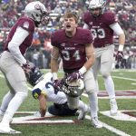 Montana linebacker Jace Lewis (34) celebrates after making a tackle against Northern Arizona in the first half of an NCAA college football game Saturday, Nov. 4, 2017, in Missoula, Mont. (AP Photo/Patrick Record)