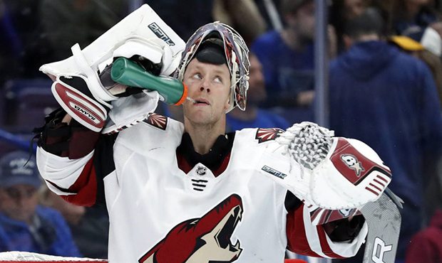 Arizona Coyotes goalie Antti Raanta, of Finland, looks toward the scoreboard after giving up a goal...