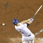 Los Angeles Dodgers' Corey Seager break his bat and grounds out against the Houston Astros during the sixth inning of Game 7 of baseball's World Series Wednesday, Nov. 1, 2017, in Los Angeles. (AP Photo/Mark J. Terrill)