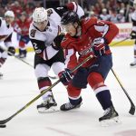 Arizona Coyotes defenseman Luke Schenn (2) battles for the puck against Washington Capitals right wing T.J. Oshie (77) during the first period of an NHL hockey game, Monday, Nov. 6, 2017, in Washington. (AP Photo/Nick Wass)