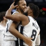 San Antonio Spurs' Patty Mills(8) pats teammate Kyle Anderson after a defensive play against the Phoenix Suns in a NBA game on Sunday, Nov. 5, 2017 in San Antonio. (AP Photo/Ronald Cortes)