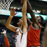 Phoenix Suns forward Dragan Bender, left, gets his shot blocked by Chicago Bulls forward Bobby Portis, right, during the first half of an NBA basketball game, Sunday, Nov. 19, 2017, in Phoenix. (AP Photo/Ross D. Franklin)