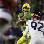 Oregon's quarterback Justin Herbert looks to pass down field against Arizona during the fourth quarter of an NCAA college football game, Saturday, Nov. 18, 2017, in Eugene, Ore. (AP Photo/Chris Pietsch)
