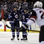 Winnipeg Jets' Adam Lowry (17)Â  and Andrew Copp (9) celebrate after Lowry scored against the Arizona Coyotes during second period NHL hockey action in Winnipeg, Manitoba, Tuesday, Nov. 14, 2017. (Trevor Hagan/The Canadian Press via AP)