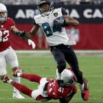 Jacksonville Jaguars wide receiver Keelan Cole (84) is tripped up by Arizona Cardinals strong safety Antoine Bethea (41) during the second half of an NFL football game, Sunday, Nov. 26, 2017, in Glendale, Ariz. (AP Photo/Rick Scuteri)