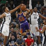 San Antonio Spurs' Kyle Anderson(1) blocks a shot attempt by Phoenix Suns' Mike James(55) during the first half of an NBA game on Sunday, Nov. 5, 2017 in San Antonio. (AP Photo/Ronald Cortes)