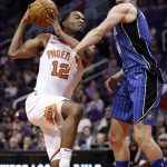 Phoenix Suns forward TJ Warren (12) drives against the Orlando Magic during the second half of an NBA basketball game, Friday, Nov. 10, 2017, in Phoenix. (AP Photo/Matt York)