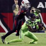 Seattle Seahawks wide receiver Paul Richardson (10) makes a catch as Arizona Cardinals safety Budda Baker (36) defends during the first half of an NFL football game, Thursday, Nov. 9, 2017, in Glendale, Ariz. (AP Photo/Rick Scuteri)