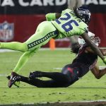 Seattle Seahawks cornerback Shaquill Griffin (26) breaks up a pass intended for Arizona Cardinals wide receiver Larry Fitzgerald (11) during the first half of an NFL football game, Thursday, Nov. 9, 2017, in Glendale, Ariz. (AP Photo/Rick Scuteri)