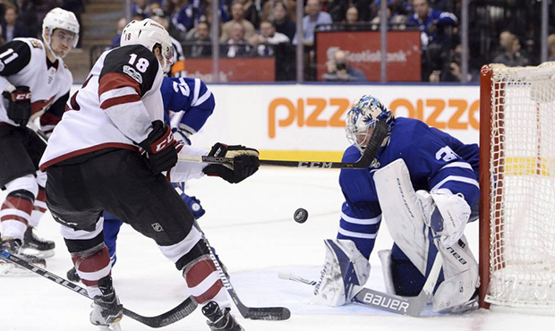 Toronto Maple Leafs goalie Frederik Andersen (31) makes a save against Arizona Coyotes center Chris...