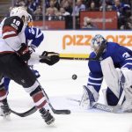 Toronto Maple Leafs goalie Frederik Andersen (31) makes a save against Arizona Coyotes center Christian Dvorak (18) during third period NHL hockey action in Toronto on Monday, Nov. 20, 2017. (Nathan Denette/The Canadian Press via AP)