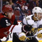 Arizona Coyotes defenseman Luke Schenn (2) tangles with Vegas Golden Knights left wing William Carrier, right, during the second period of an NHL hockey game Saturday, Nov. 25, 2017, in Glendale, Ariz. The Golden Knights defeated the Coyotes 4-2. (AP Photo/Ross D. Franklin)