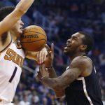 Brooklyn Nets guard Sean Kilpatrick (6) loses the ball to Phoenix Suns guard Devin Booker (1) during the first half of an NBA basketball game Monday, Nov. 6, 2017, in Phoenix. (AP Photo/Ross D. Franklin)