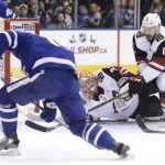Arizona Coyotes goalie Antti Raanta (32) watches the puck and center Brad Richardson (15) defends as Toronto Maple Leafs center Auston Matthews, left, tries get a shot into the net during first-period NHL hockey game action in Toronto, Monday, Nov. 20, 2017. (Nathan Denette/The Canadian Press via AP)