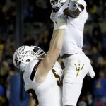 Arizona State running back Demario Richard, right, celebrates his touchdown with offensive lineman Quinn Bailey during the first half of an NCAA college football game against UCLA in Pasadena, Calif., Saturday, Nov. 11, 2017. (AP Photo/Chris Carlson)
