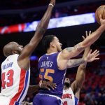 Phoenix Suns guard Mike James (55) goes to the basket against Detroit Pistons forwards Anthony Tolliver (43) and Tobias Harris, right, during the first half of an NBA basketball game Wednesday, Nov. 29, 2017 in Detroit. (AP Photo/Duane Burleson)