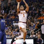 Phoenix Suns guard Devin Booker (1) shoots against the Orlando Magic during the second half of an NBA basketball game, Friday, Nov. 10, 2017, in Phoenix. (AP Photo/Matt York)