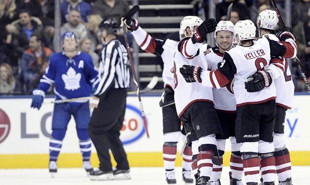The Arizona Coyotes celebrate a goal during second period NHL hockey action against the Toronto Map...