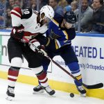 Arizona Coyotes' Anthony Duclair (10) and St. Louis Blues' Jaden Schwartz chase the puck along the boards during the first period of an NHL hockey game Thursday, Nov. 9, 2017, in St. Louis. (AP Photo/Jeff Roberson)