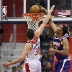 Phoenix Suns forward TJ Warren, right, goes to the basket against Washington Wizards guard Tomas Satoransky (31), of the Czech Republic, during the first half of an NBA basketball game, Wednesday, Nov. 1, 2017, in Washington. (AP Photo/Nick Wass)