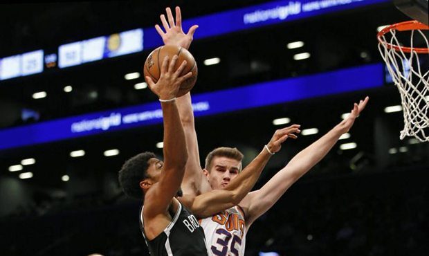 Phoenix Suns forward Dragan Bender (35) blocks a shot by Brooklyn Nets guard Spencer Dinwiddie, cen...