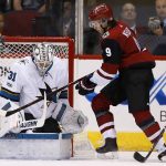 San Jose Sharks goalie Martin Jones (31) makes a save on a shot by Arizona Coyotes center Clayton Keller (9) as Sharks defenseman Marc-Edouard Vlasic (44) watches during the first period of an NHL hockey game Wednesday, Nov. 22, 2017, in Glendale, Ariz. The Sharks defeated the Coyotes 3-1. (AP Photo/Ross D. Franklin)