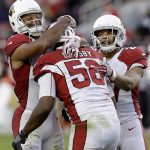 Arizona Cardinals inside linebacker Karlos Dansby (56) celebrates with Larry Fitzgerald, left, and Tyvon Branch after intercepting a pass by San Francisco 49ers quarterback C.J. Beathard during the second half of an NFL football game in Santa Clara, Calif., Sunday, Nov. 5, 2017. (AP Photo/Ben Margot)