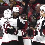 Arizona Coyotes' Anthony Duclair (10) celebrates his goal with teammates Max Domi (16) and Christian Dvorak (18)  during the first period of an NHL hockey game against the Ottawa Senators in Ottawa, Saturday, Nov. 18, 2017. (Justin Tang/The Canadian Press via AP)
