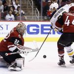 Arizona Coyotes goalie Antti Raanta (32) makes a stick save on a shot by Buffalo Sabres center Zemgus Girgensons (28) as Coyotes' Kevin Connauton (44) defends during the first period of an NHL hockey game Thursday, Nov. 2, 2017, in Glendale, Ariz. (AP Photo/Ross D. Franklin)
