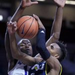 Northern Arizona guard Gino Littles (3) is covered by Kansas State forward Makol Mawien, back, during the first half of an NCAA college basketball game in Manhattan, Kan., Monday, Nov. 20, 2017. (AP Photo/Orlin Wagner)