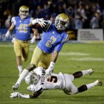 UCLA wide receiver Jordan Lasley is tackled by Arizona State defensive back Kobe Williams during the second half of an NCAA college football game in Pasadena, Calif., Saturday, Nov. 11, 2017. UCLA won 44-37. (AP Photo/Chris Carlson)
