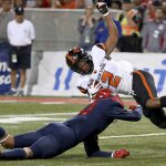 Arizona wide receiver Shawn Poindexter (19) nails Oregon State cornerback Shawn Wilson (2), dropping him at the 3-yard line after Wilson tried to run back an interception during the first quarter of an NCAA college football game Saturday, Nov. 11, 2017, Tucson, Ariz. (Kelly Presnell/Arizona Daily Star via AP)