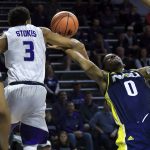 Northern Arizona guard Torry Johnson (0) is fouled by Kansas State guard Kamau Stokes (3) during the first half of an NCAA college basketball game in Manhattan, Kan., Monday, Nov. 20, 2017. (AP Photo/Orlin Wagner)