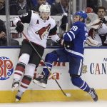 Arizona Coyotes defenseman Oliver Ekman-Larsson (23) hits Toronto Maple Leafs center William Nylander (29) along the sideboards during first period NHL hockey action in Toronto on Monday, Nov. 20, 2017. (Nathan Denette/The Canadian Press via AP)