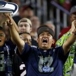 Seattle Seahawks fans cheer during the first half of an NFL football game against the Arizona Cardinals, Thursday, Nov. 9, 2017, in Glendale, Ariz. (AP Photo/Ross D. Franklin)