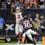 Arizona Cardinals wide receiver Larry Fitzgerald (11) reaches for the ball to make a touchdown catch over Houston Texans cornerback Kevin Johnson (30) during the first half of an NFL football game, Sunday, Nov. 19, 2017, in Houston. (AP Photo/David J. Phillip)