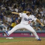 Los Angeles Dodgers' Clayton Kershaw makes a relief appearance during the third inning of Game 7 of baseball's World Series against the Houston Astros Wednesday, Nov. 1, 2017, in Los Angeles. (AP Photo/David J. Phillip)