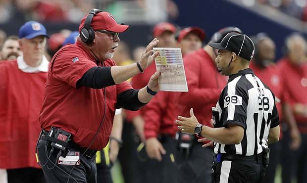 Arizona Cardinals head coach Bruce Arians, left, argues a call during the first half of an NFL foot...