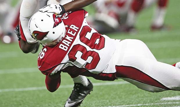 Arizona Cardinals safety Budda Baker (36) tackles Atlanta Falcons wide receiver Deante Burton (87) ...