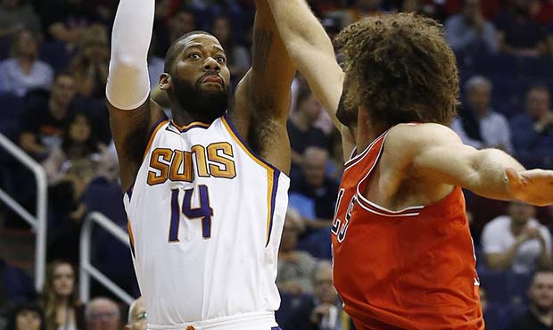 Phoenix Suns center Greg Monroe (14) shoots over Chicago Bulls center Robin Lopez (42) during the f...