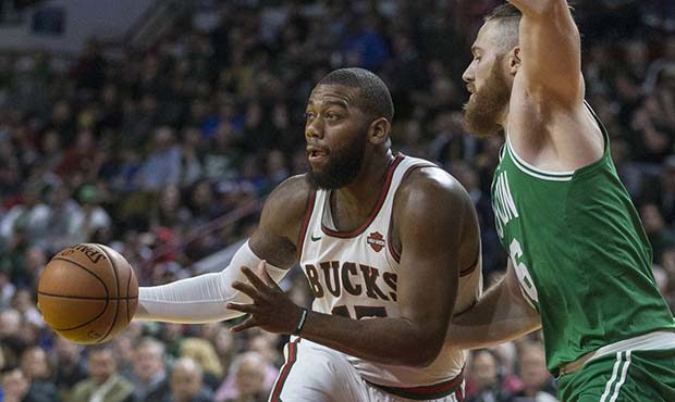 Milwaukee Bucks' Greg Monroe drives on Boston Celtics' Aron Baynes during the first half of an NBA ...