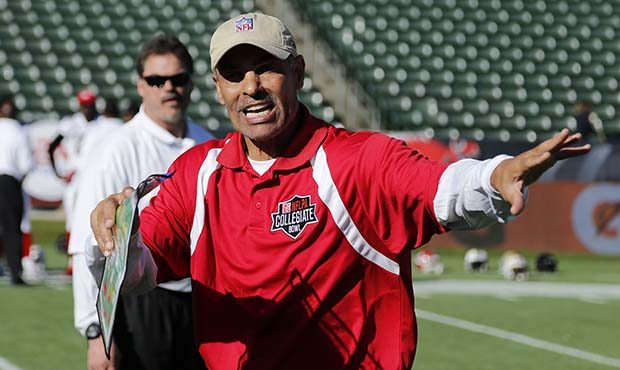 Coaches Herm Edwards talks with his players during the NFLPA Collegiate Bowl American team practice...